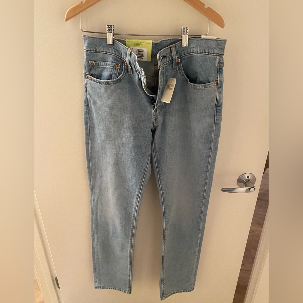 Levis 511 men’s light wash jeans 31x32. Unworn, tags still on